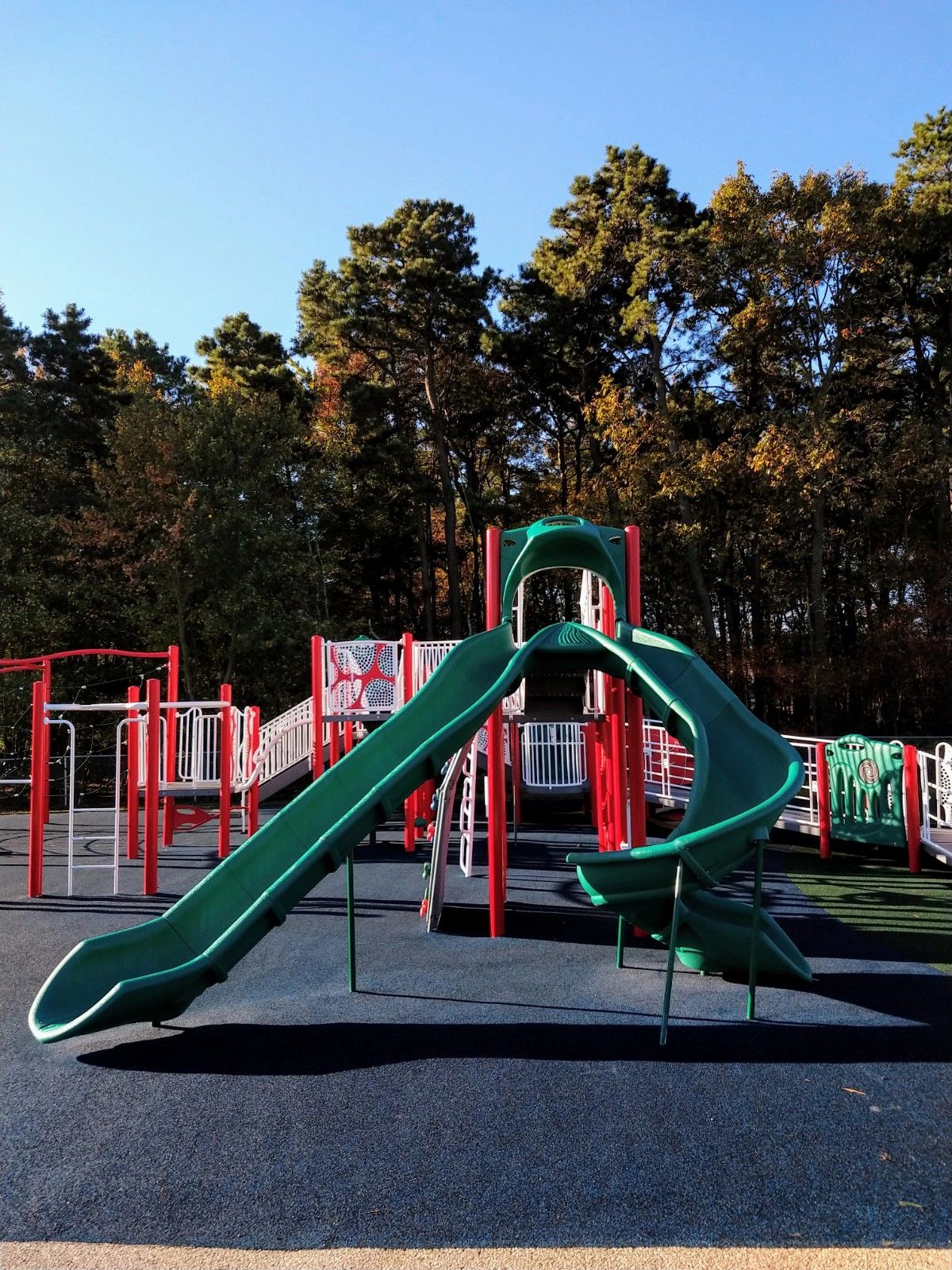 Colorful playground with red and green slides